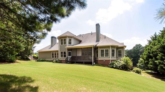 240 Chandler Walk, Loganville, GA 30052 - rear view of property with a lawn, a sunroom, and a chimney
