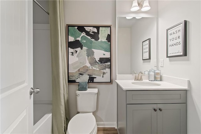 full bathroom featuring vanity, shower / bath combination with curtain, and toilet