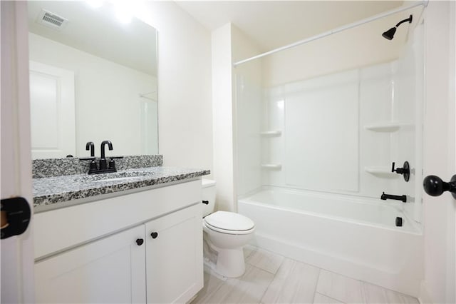 full bathroom with vanity, toilet, and shower / bath combination