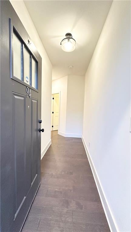 hallway featuring dark hardwood / wood-style floors