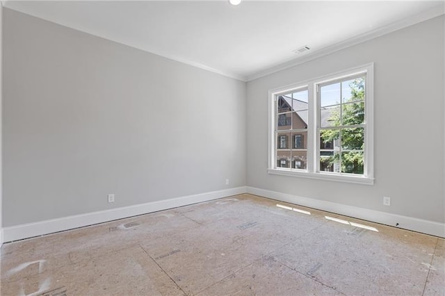 spare room with crown molding