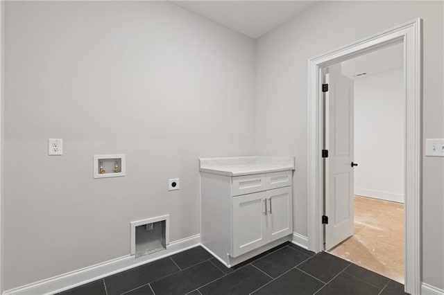 laundry area featuring washer hookup, dark tile patterned floors, and electric dryer hookup