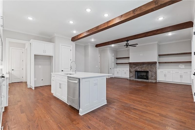 kitchen with dishwasher, a center island with sink, sink, dark wood-type flooring, and white cabinets