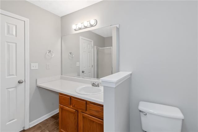 97 Spring Leaf Dr, Dallas, GA 30157 - bathroom with a shower stall, vanity, baseboards, and toilet