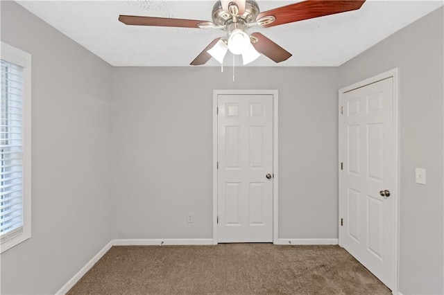 97 Spring Leaf Dr, Dallas, GA 30157 - unfurnished bedroom with baseboards, a ceiling fan, and carpet floors