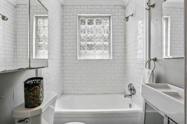 full bathroom with vanity, plenty of natural light, toilet, and tiled shower / bath