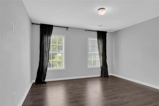 581 Collingsworth Ln, Lawrenceville, GA 30043 - empty room featuring dark wood-style flooring and baseboards