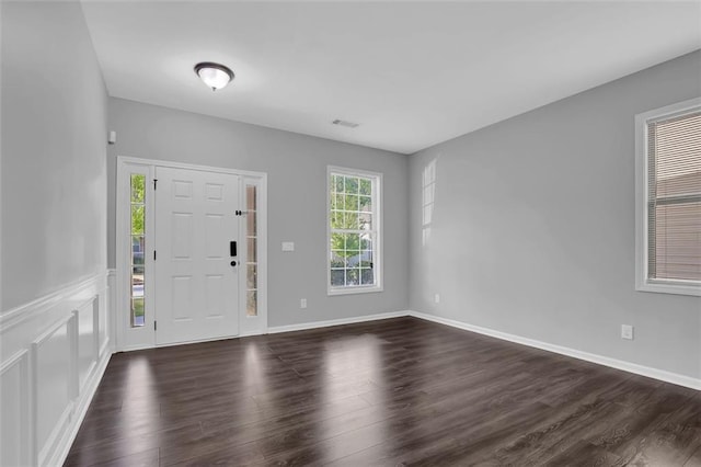 581 Collingsworth Ln, Lawrenceville, GA 30043 - foyer entrance featuring dark wood finished floors and baseboards