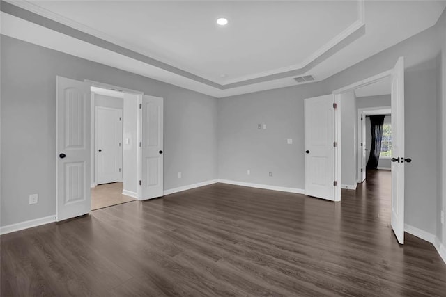 581 Collingsworth Ln, Lawrenceville, GA 30043 - unfurnished room featuring a tray ceiling, baseboards, dark wood-type flooring, and recessed lighting