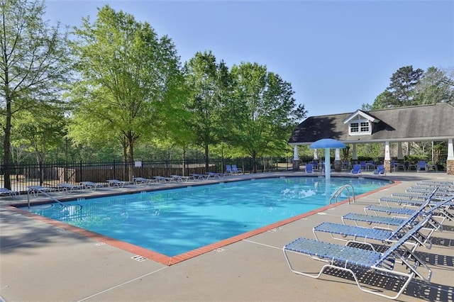581 Collingsworth Ln, Lawrenceville, GA 30043 - community pool featuring a patio area and view of scattered trees