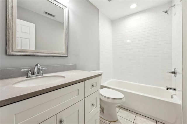 bathroom with visible vents, toilet, vanity, shower / tub combination, and tile patterned floors