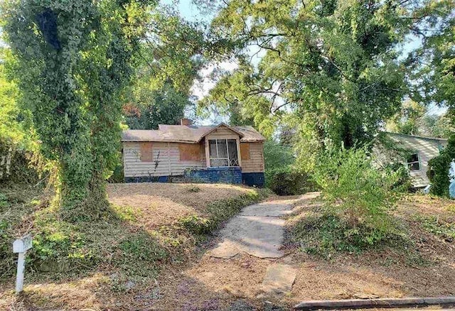 view of front of home with a chimney