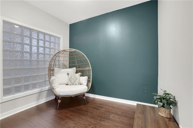 sitting room featuring hardwood / wood-style flooring and a wealth of natural light