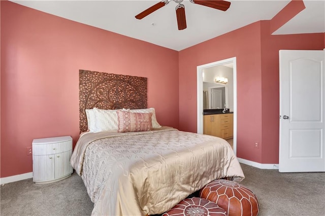 bedroom featuring ceiling fan, ensuite bathroom, and carpet floors