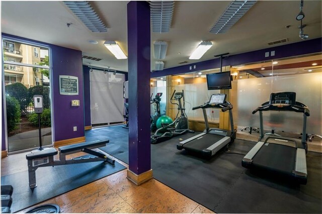 workout area featuring a barn door