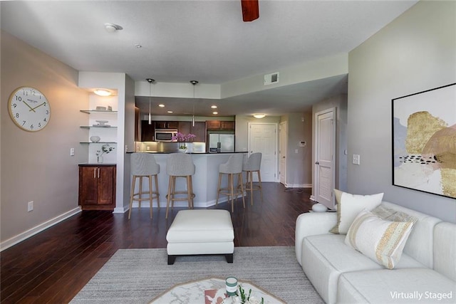 living room with dark hardwood / wood-style floors