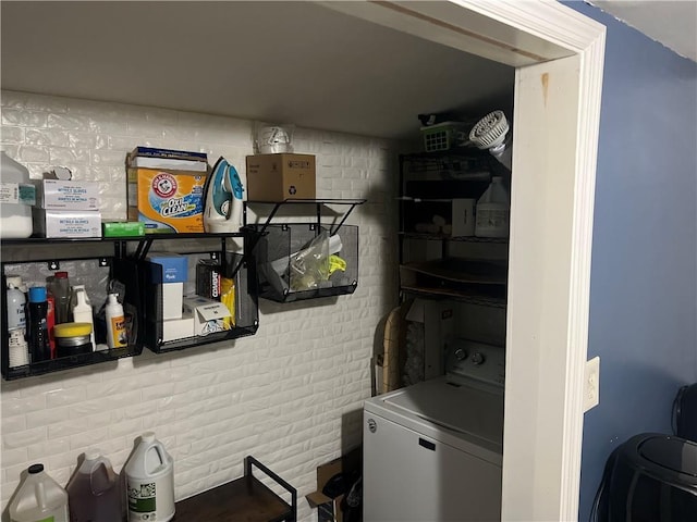 1506 Ravenel Rd, Conley, GA 30288 - washroom featuring washer / dryer and brick wall