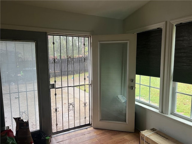 1506 Ravenel Rd, Conley, GA 30288 - doorway to outside with light wood finished floors and lofted ceiling