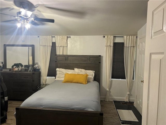 1506 Ravenel Rd, Conley, GA 30288 - bedroom featuring ceiling fan, baseboards, and dark wood-style flooring