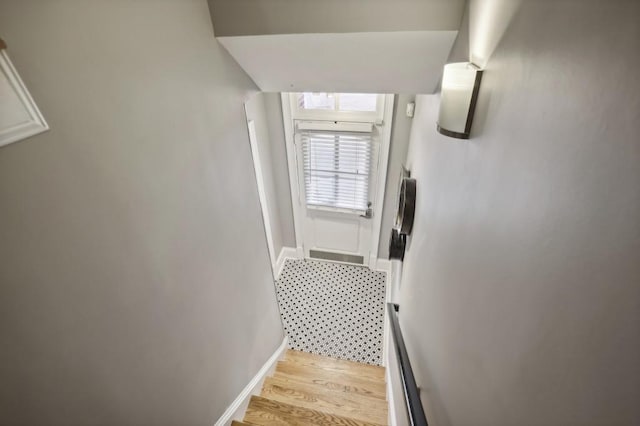 stairs with wood-type flooring