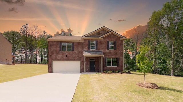 view of front of house with a garage and a lawn