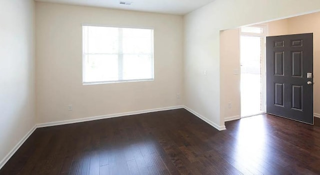 foyer entrance with dark wood-type flooring