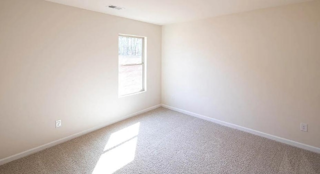 spare room with carpet