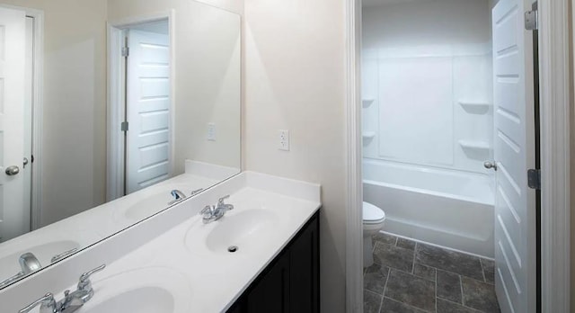 full bathroom with vanity, tub / shower combination, and toilet