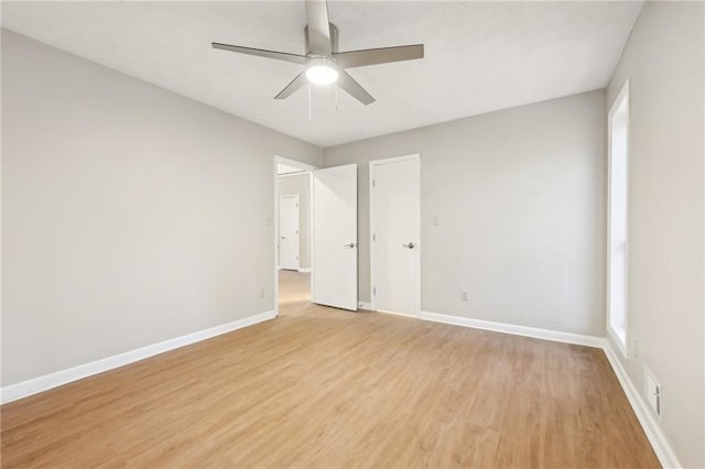 unfurnished room featuring ceiling fan and light hardwood / wood-style flooring