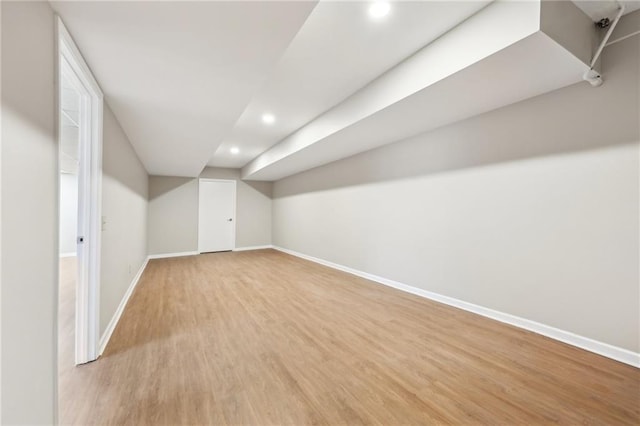 bonus room with light wood-type flooring