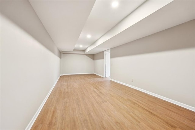 basement featuring light hardwood / wood-style floors