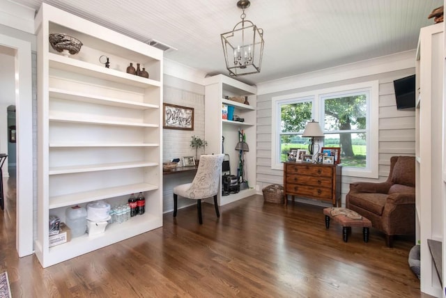 home office featuring dark wood-style flooring and a chandelier