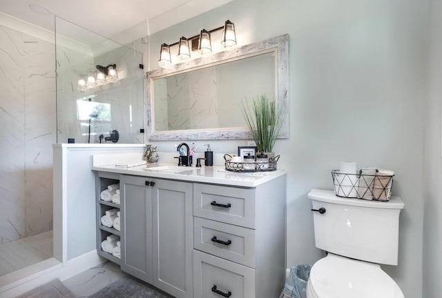 full bathroom featuring marble finish floors, a marble finish shower, vanity, and toilet