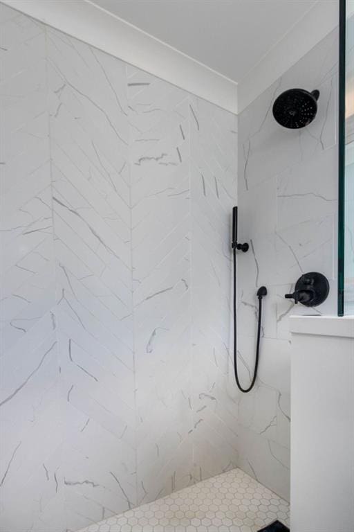 full bath featuring a marble finish shower