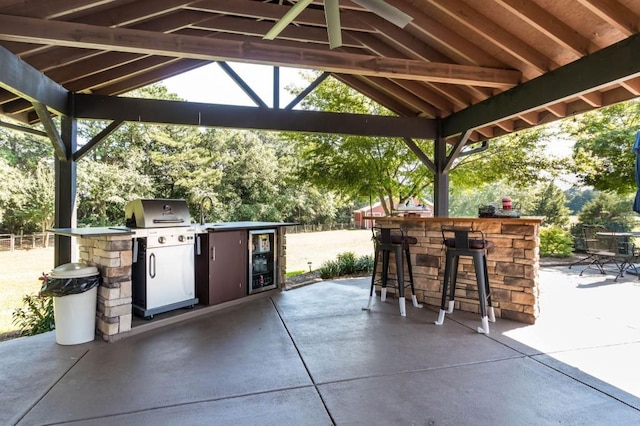 view of patio featuring a gazebo and wine cooler