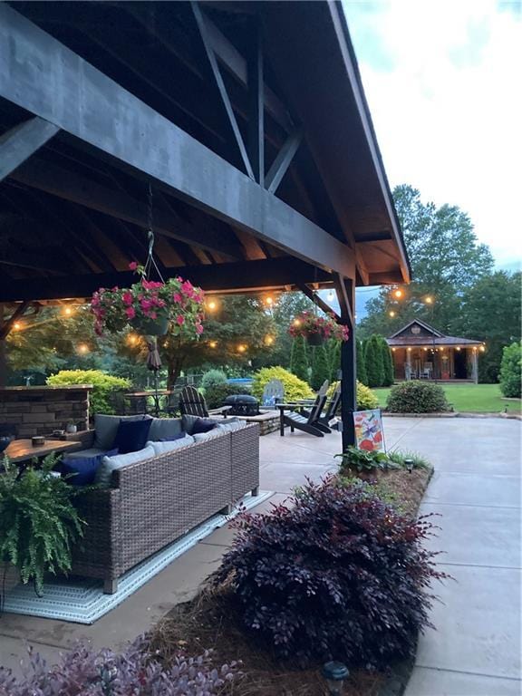 surrounding community with an outdoor hangout area, a patio area, and a gazebo