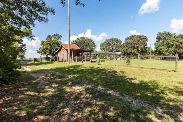 view of yard featuring an outbuilding and an exterior structure