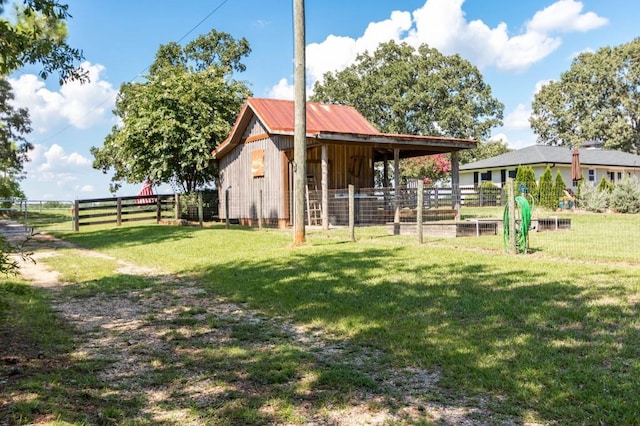view of yard featuring an exterior structure and an outbuilding