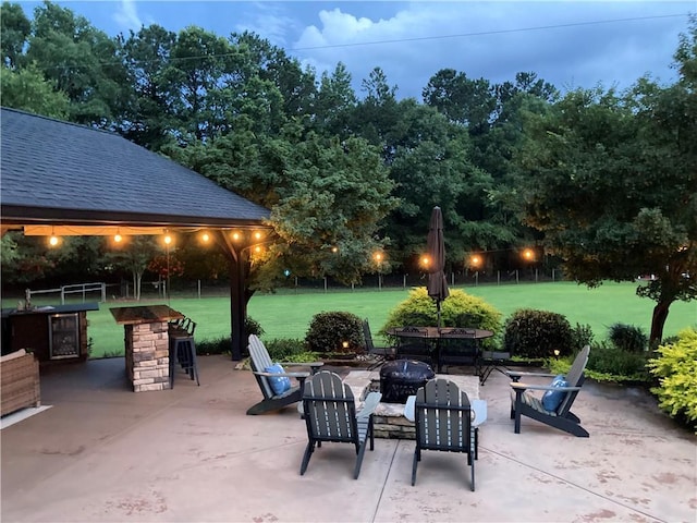 view of patio / terrace featuring a fire pit and a sink