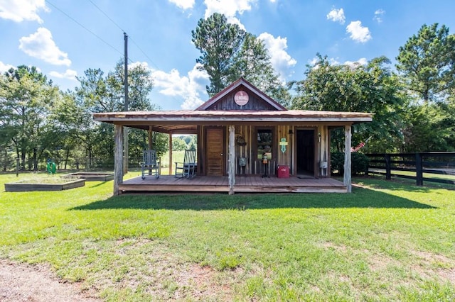 view of property's community featuring a vegetable garden and a wooden deck