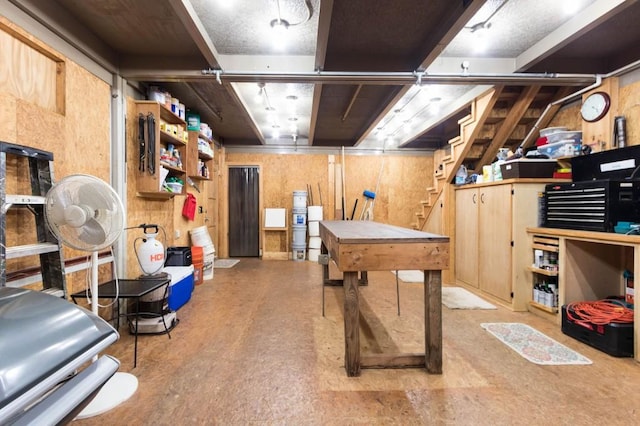 basement featuring stairs