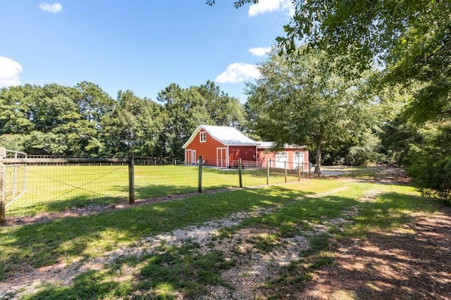 view of yard featuring a barn and an outdoor structure