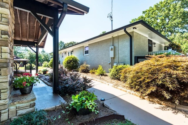 view of property exterior featuring brick siding