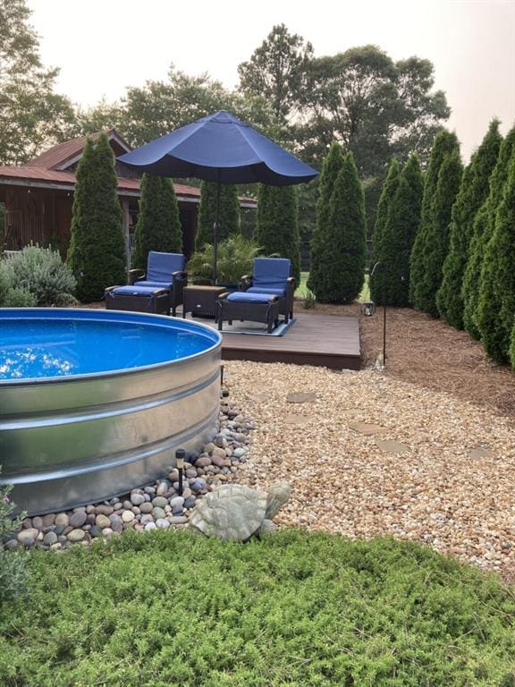 swimming pool with a wooden deck