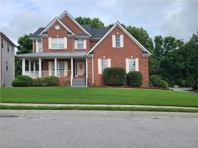 craftsman-style home with a porch and a front yard