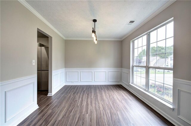 4975 Rockstone Way, Acworth, GA 30101 - unfurnished room featuring a textured ceiling, dark wood finished floors, wainscoting, ornamental molding, and a decorative wall
