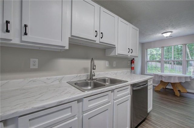 4975 Rockstone Way, Acworth, GA 30101 - kitchen featuring dishwasher, white cabinetry, light countertops, a textured ceiling, and wood finished floors