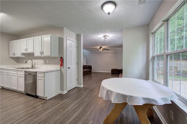 4975 Rockstone Way, Acworth, GA 30101 - kitchen with dishwasher, a textured ceiling, dark wood-style floors, light countertops, and a ceiling fan