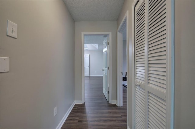 4975 Rockstone Way, Acworth, GA 30101 - corridor with dark wood-type flooring and a textured ceiling