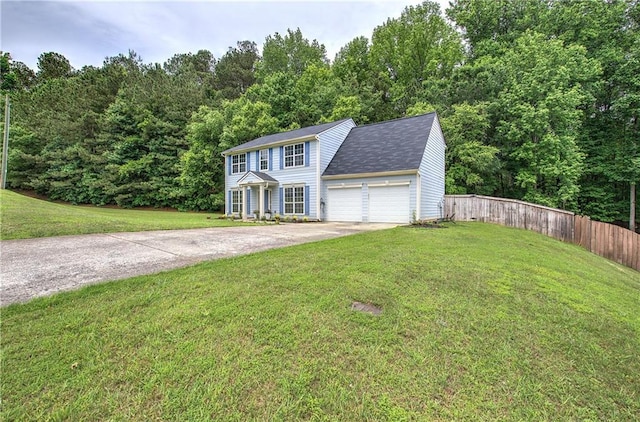 4975 Rockstone Way, Acworth, GA 30101 - colonial house featuring driveway, an attached garage, a view of trees, and roof with shingles